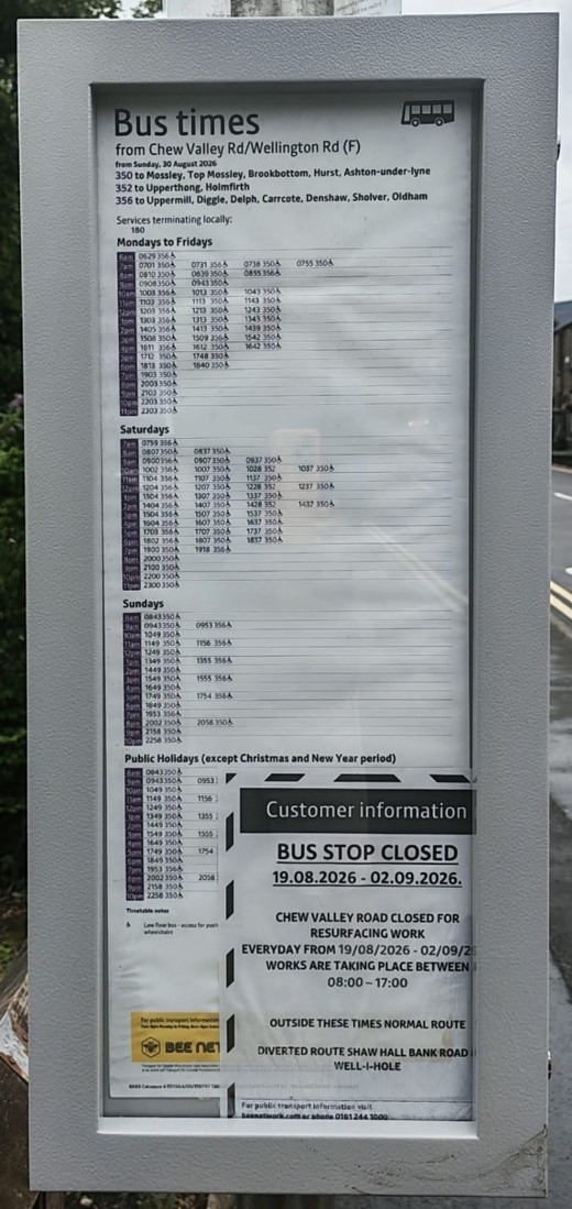 A traditional printed bus stop timetable panel listing departure times by day, with a customer information notice.